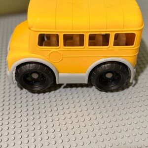Sunny Yellow Toy Bus with Black Wheels
